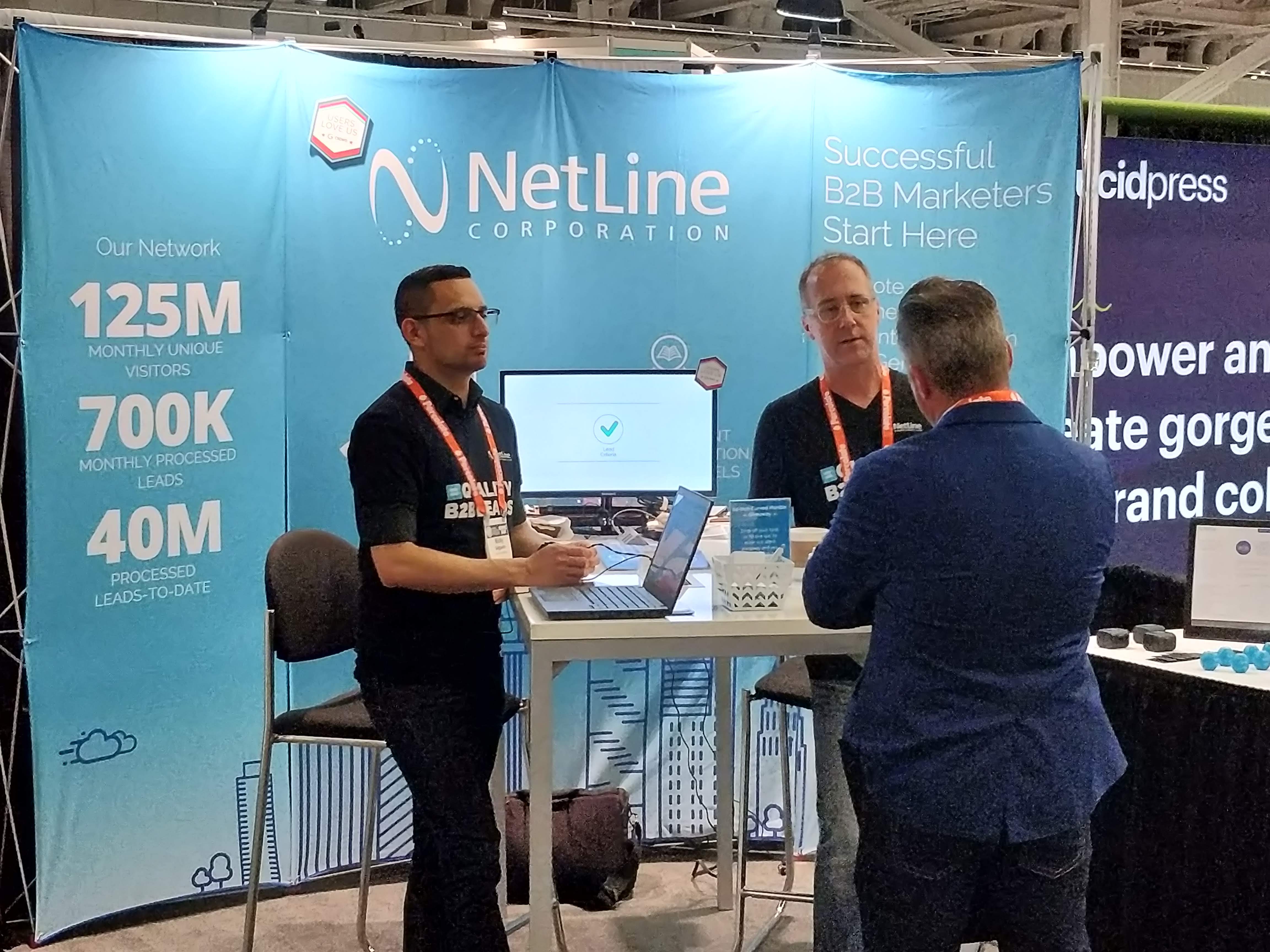 NetLine booth at CMWorld Ricky Salguero Phil Reid